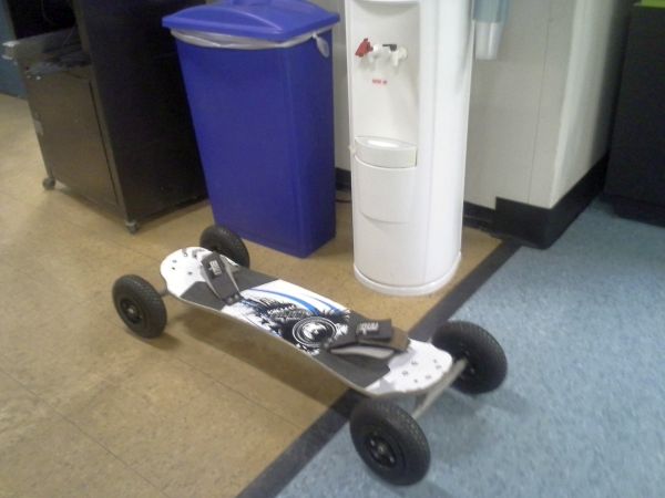 mountain board sitting next to water cooler