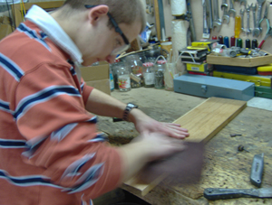 lightly sanding the copperboard for toner application