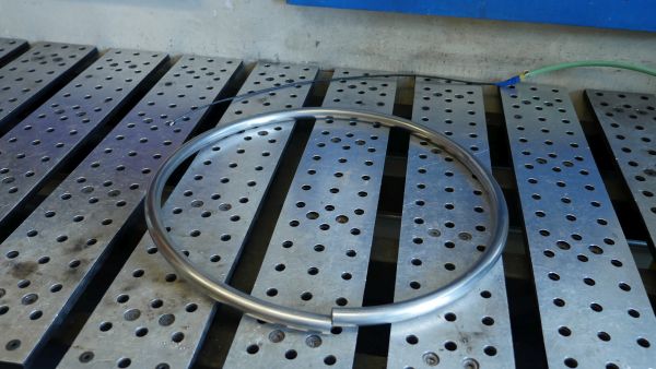 rolled stainless hoop on a welding tabel